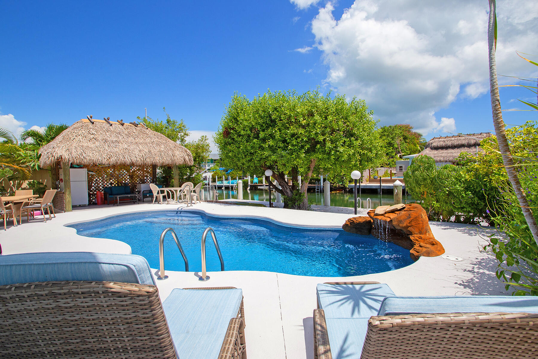 a view of a swimming pool with a patio