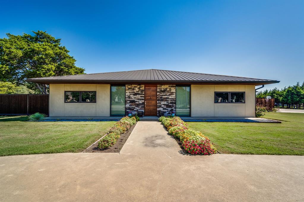 front view of a house with a garden