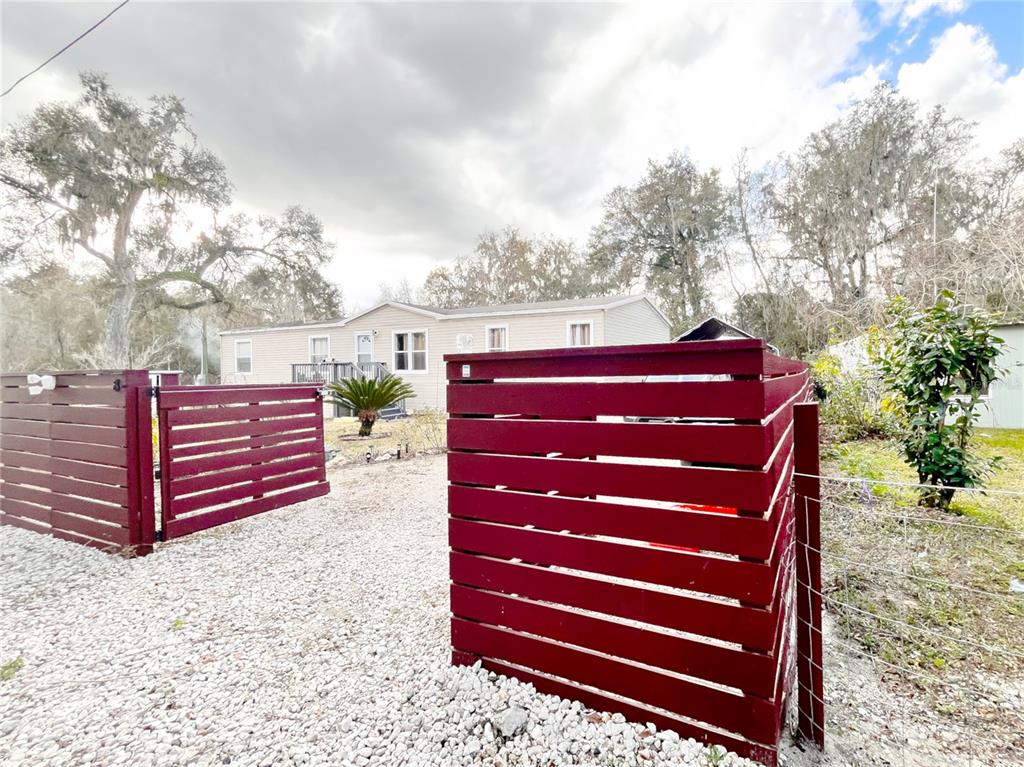 a bench sitting in the middle of a yard