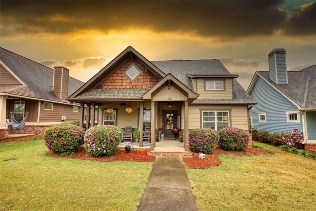 a front view of a house with garden