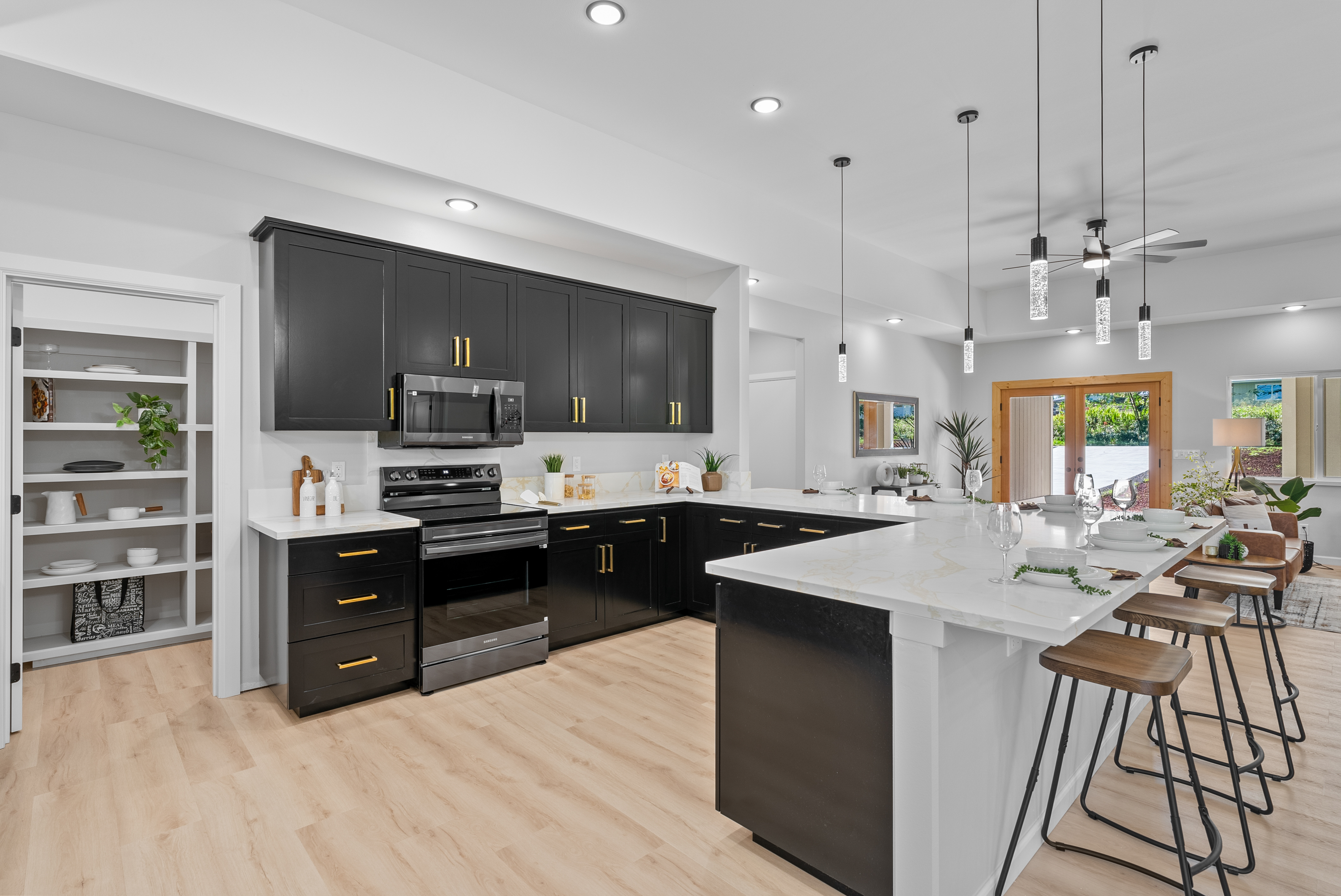 a kitchen with stainless steel appliances kitchen island granite countertop a sink and cabinets