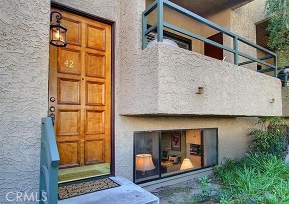 a view of a house with a door and a window