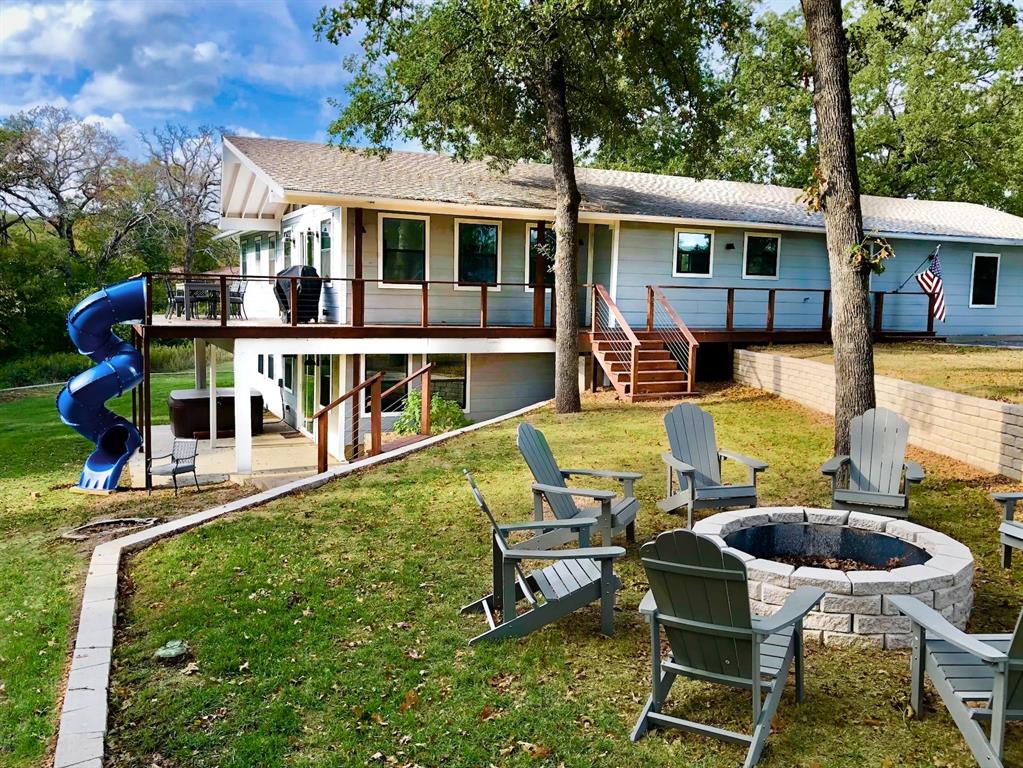 a view of a house with swimming pool and porch