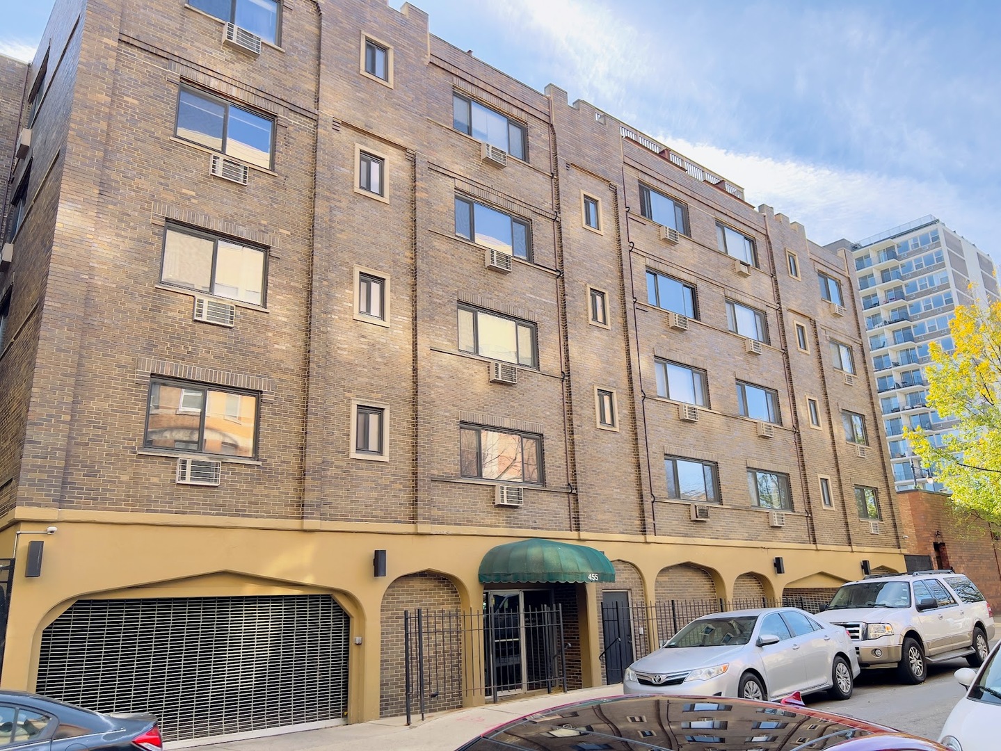 a front view of a building with parking space