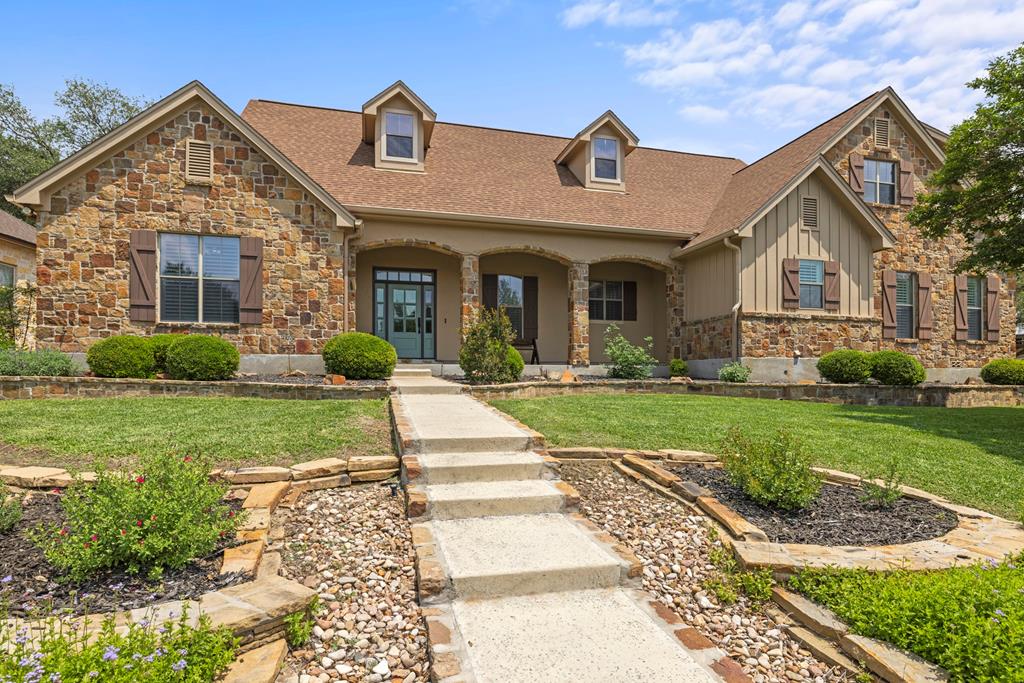 a front view of a house with a yard