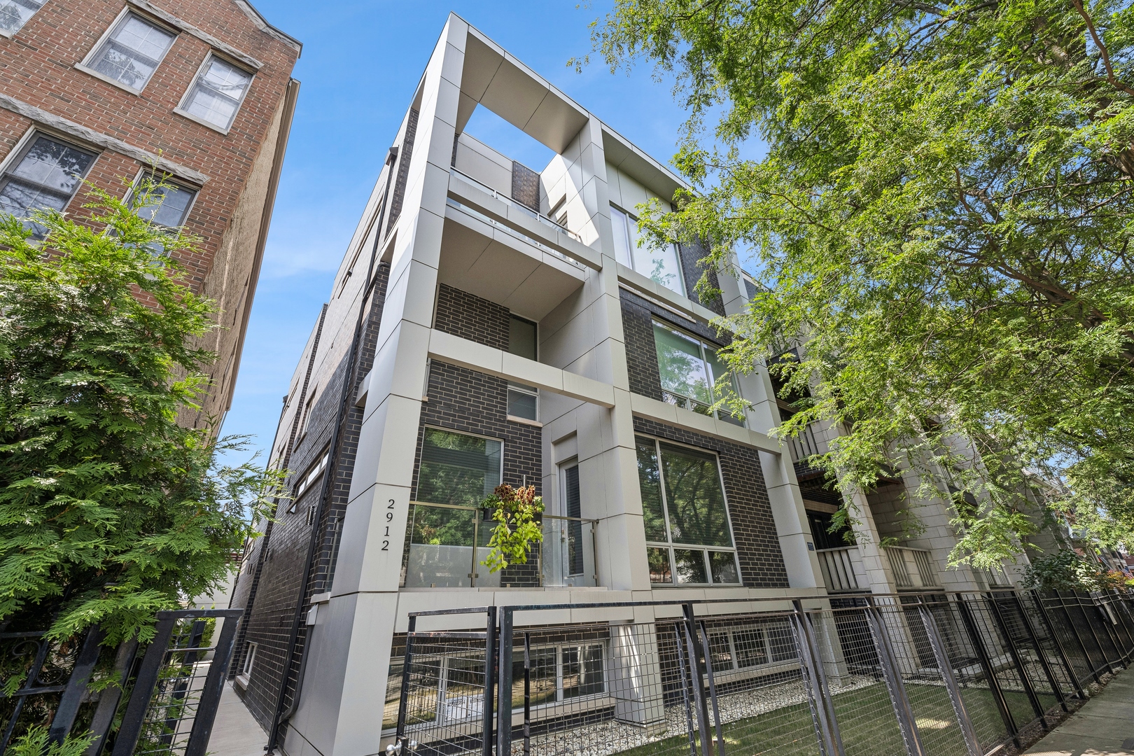 a view of a building with a tree