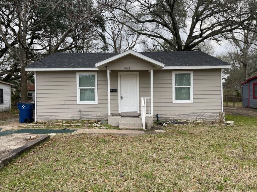 a house with trees in the background