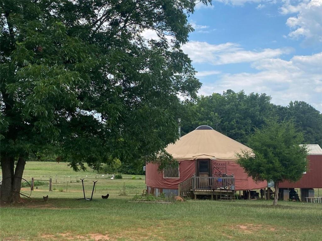 a view of a house with a backyard