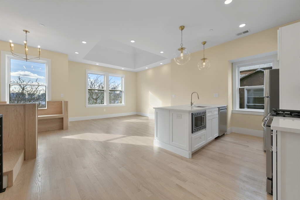 a view of a kitchen with furniture and a fireplace