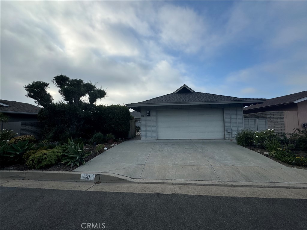 a house with yard in front of it