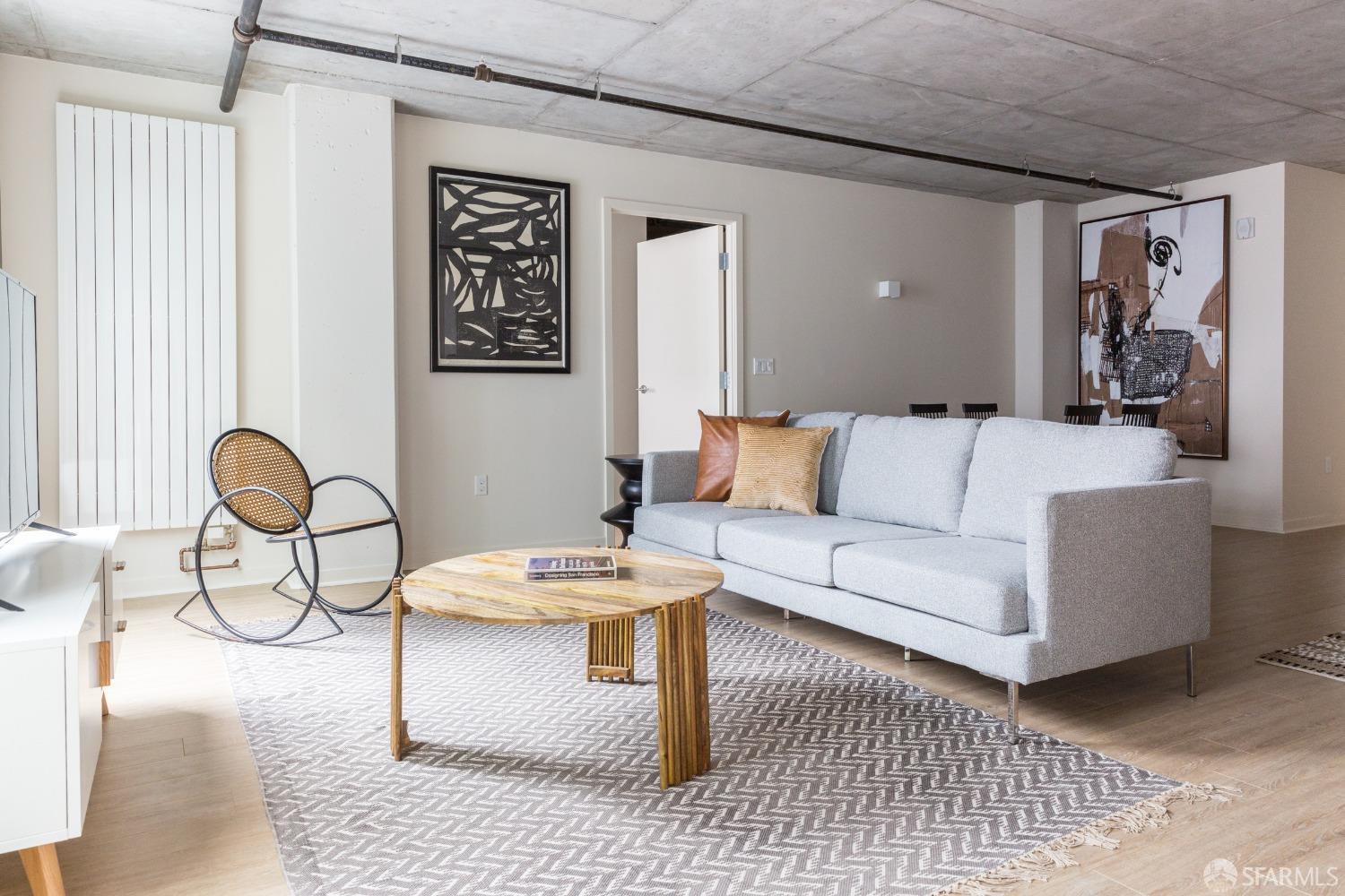 a living room with furniture and a table