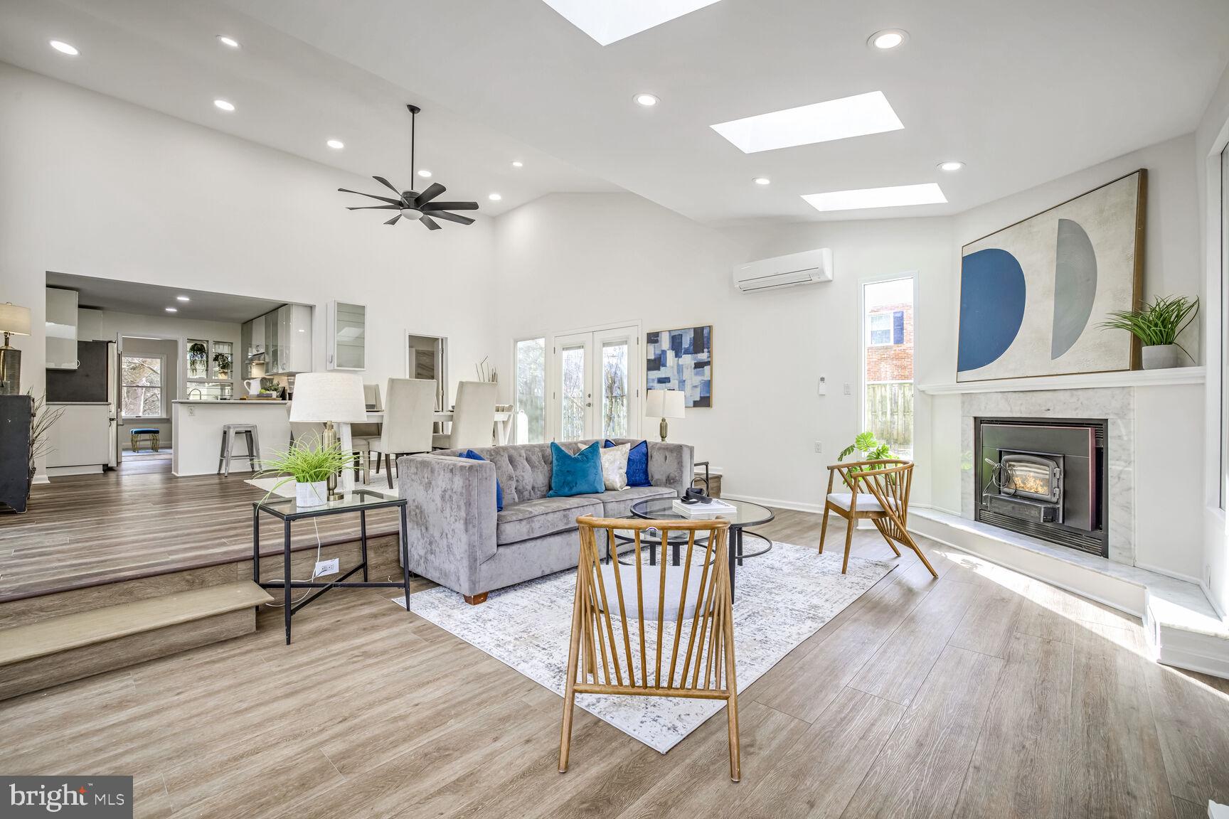 Great room with vaulted ceilings and skylights