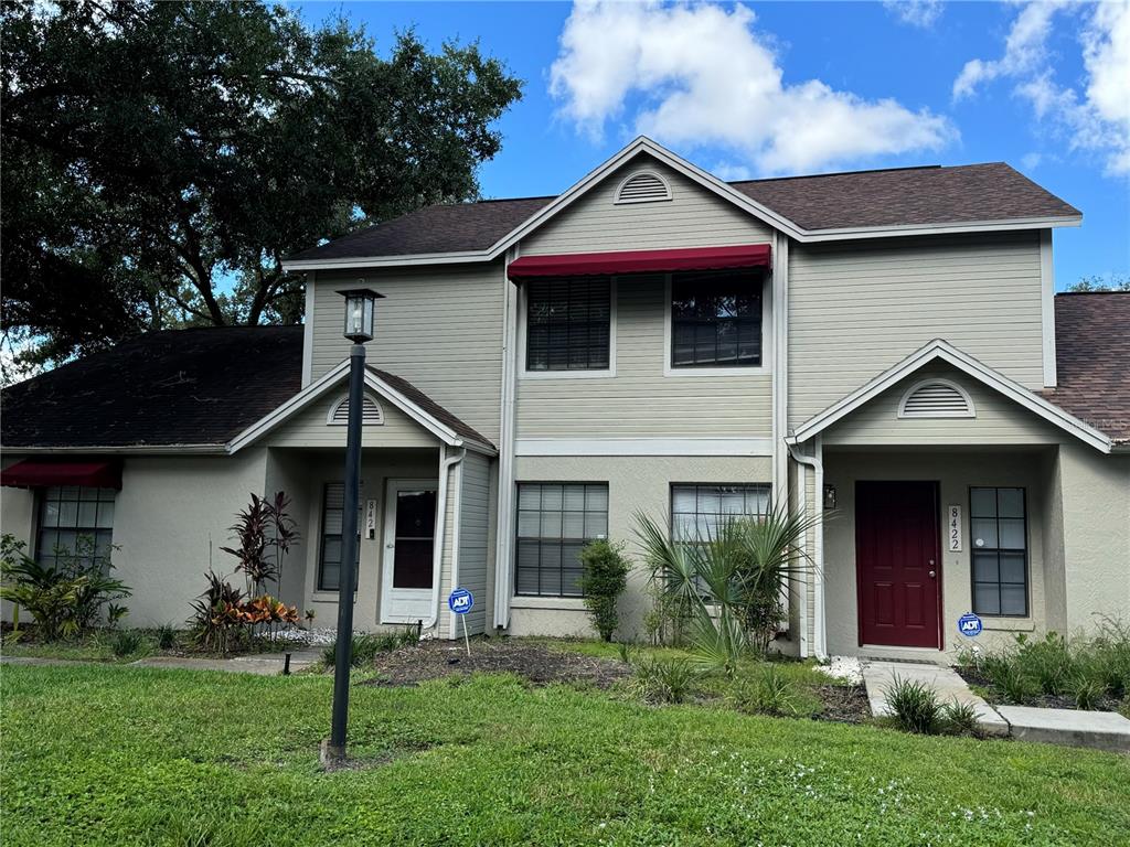 a front view of a house with a yard