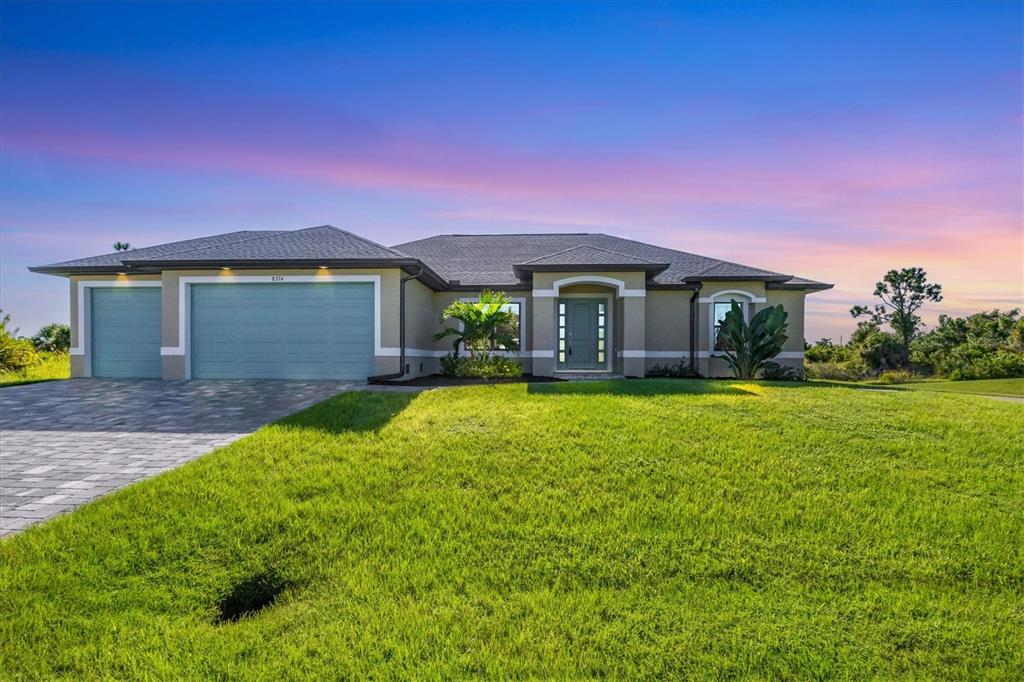 a front view of a house with a yard