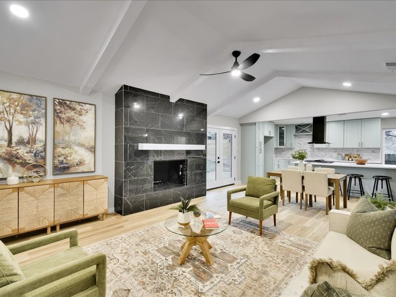 a living room with furniture and a fireplace