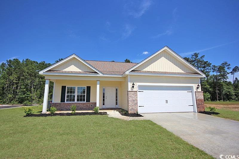 View of front of property with a front lawn and a