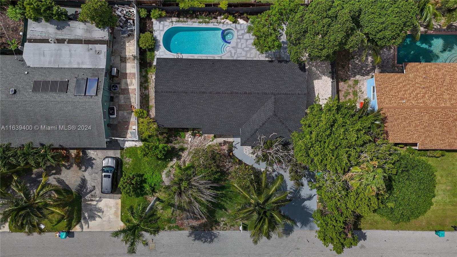 an aerial view of a house with a yard and garden