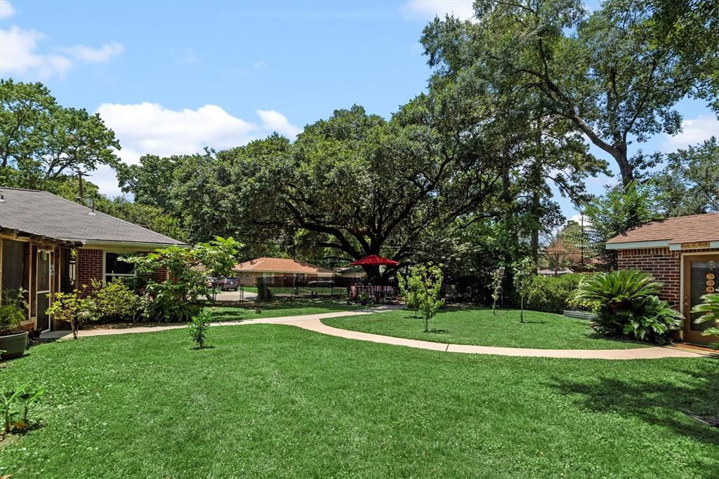 a view of a house with a yard porch and sitting area