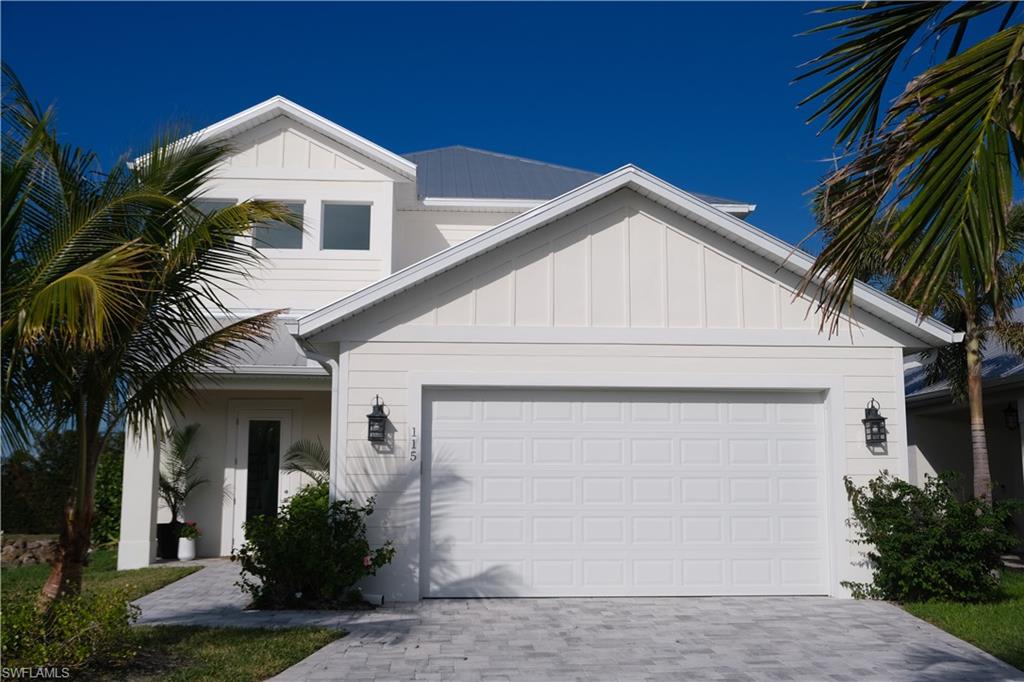 a front view of a house with a garage