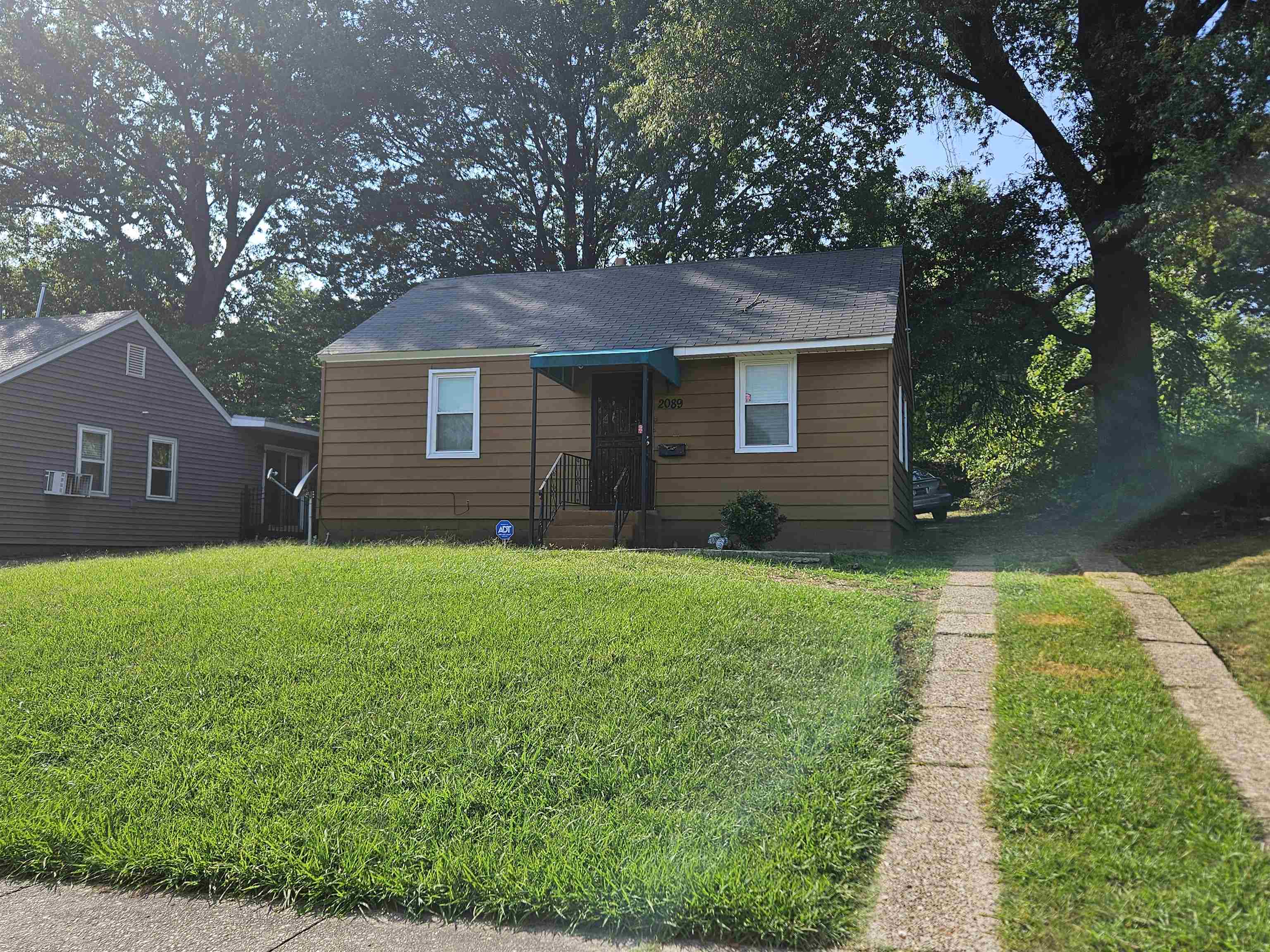 Bungalow-style home featuring a front lawn