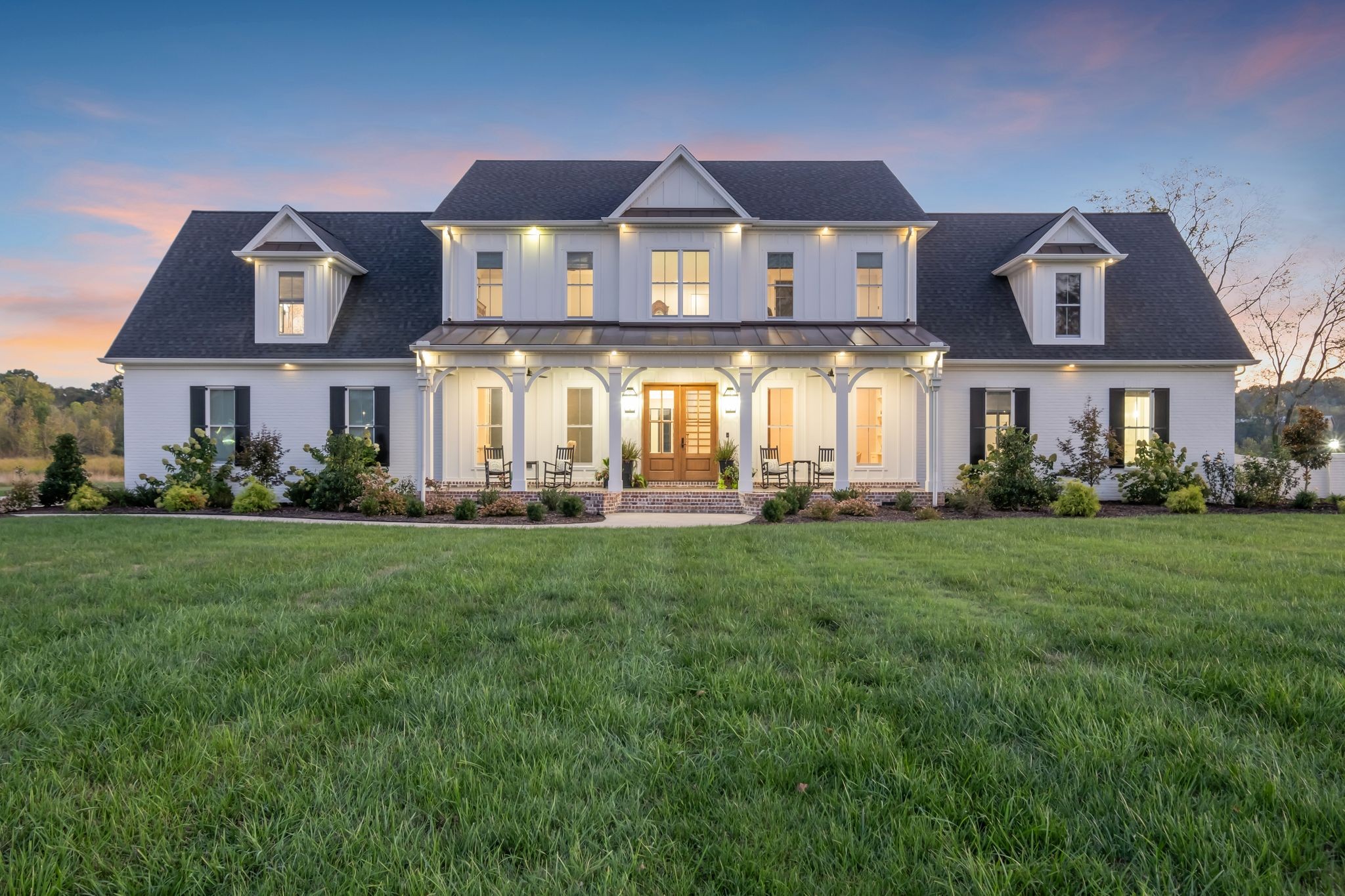 a front view of a house with a yard