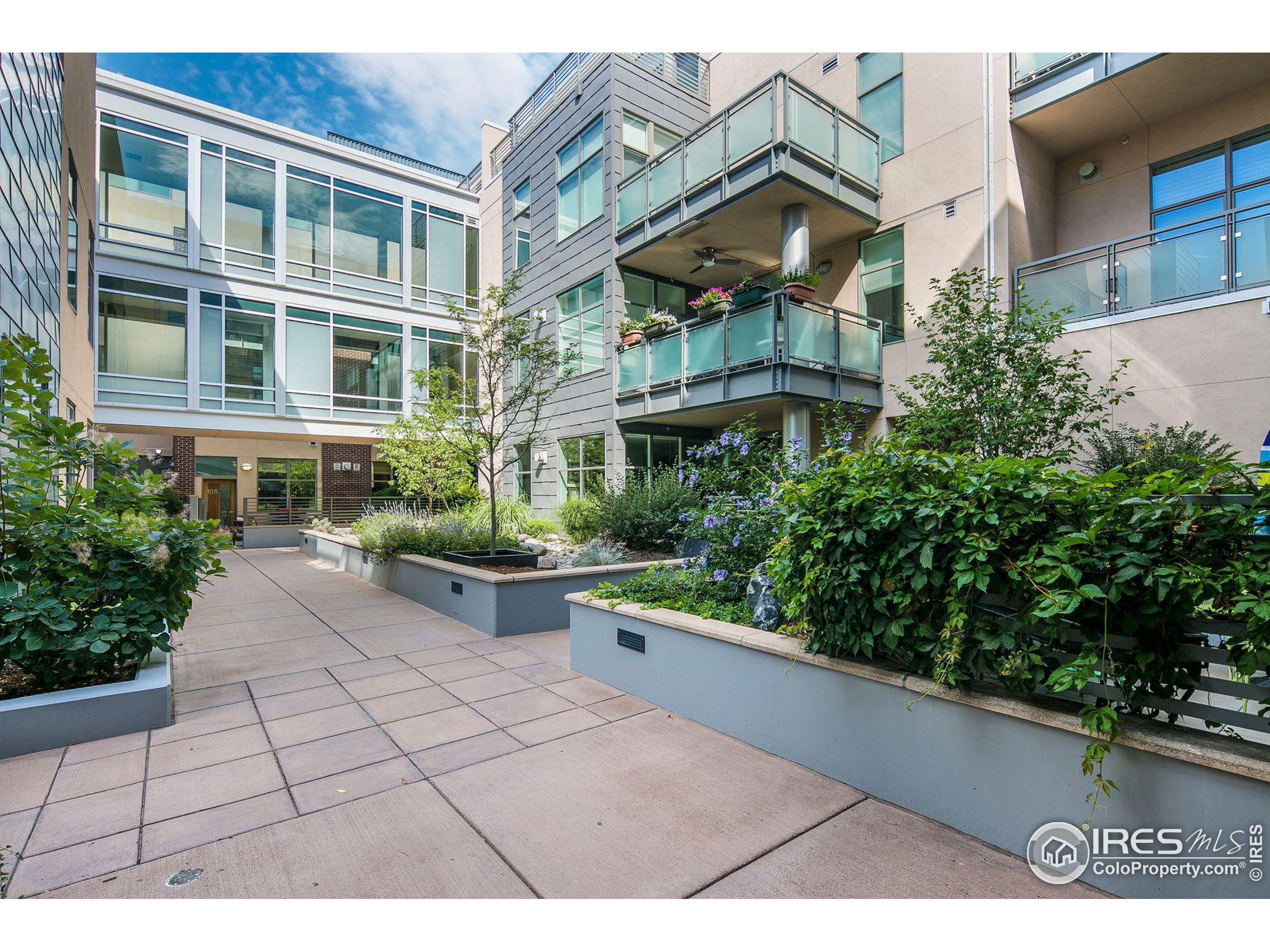 a view of a building with potted plants