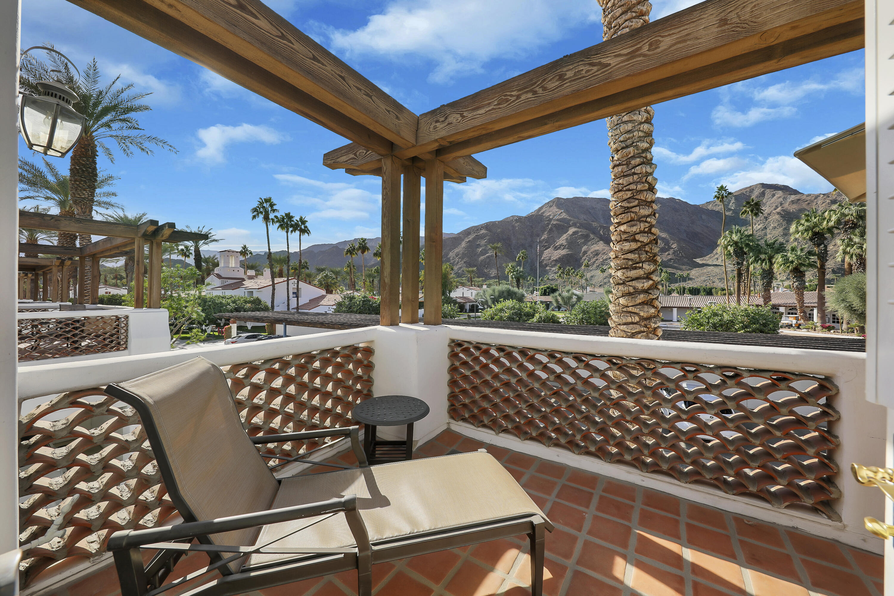 a view of balcony with furniture