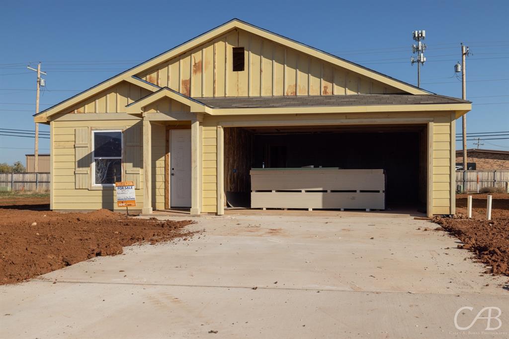 a front view of a house with garage