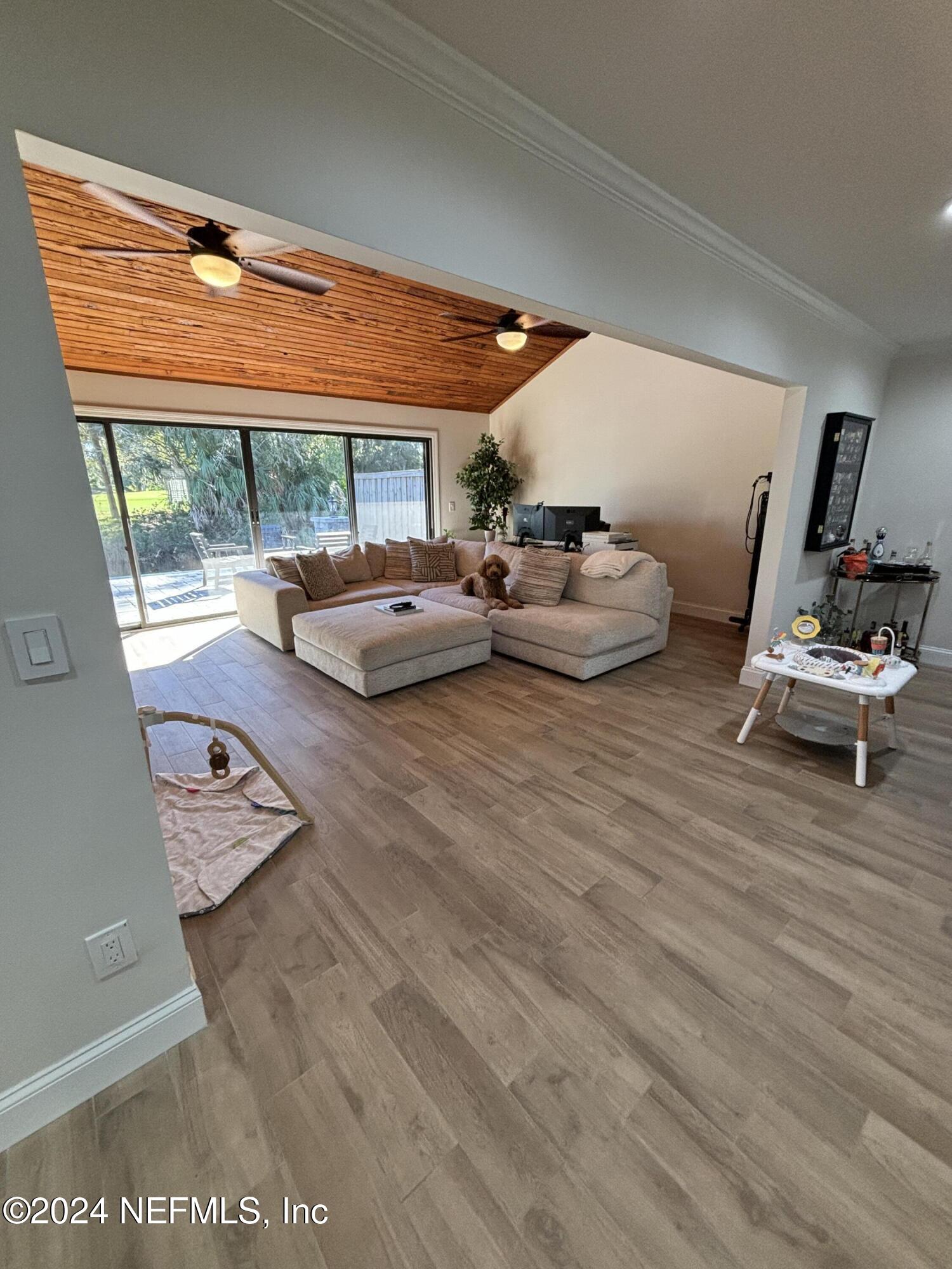 a view of a room with workspace and a window