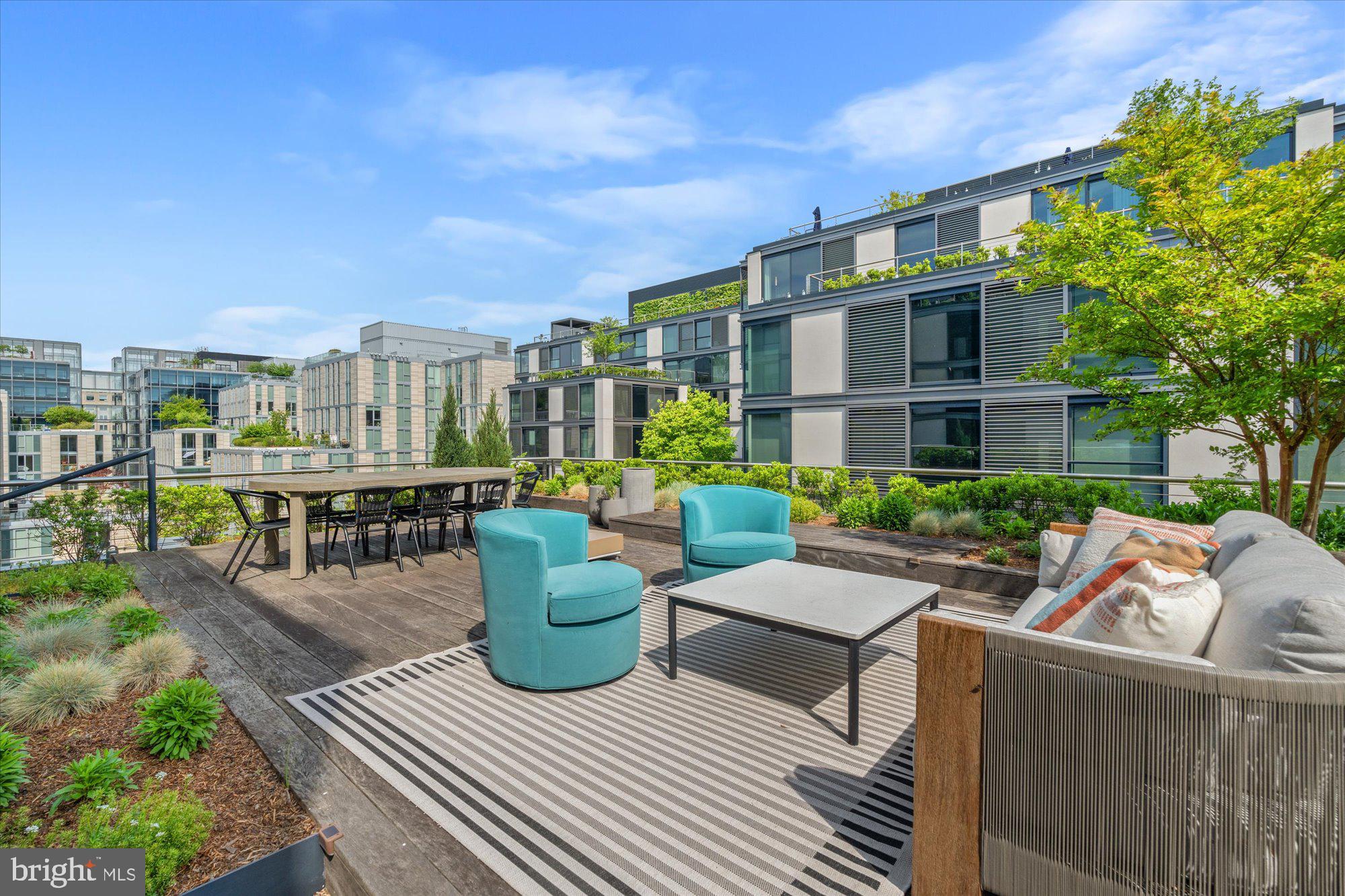 a view of a patio with couches and potted plants