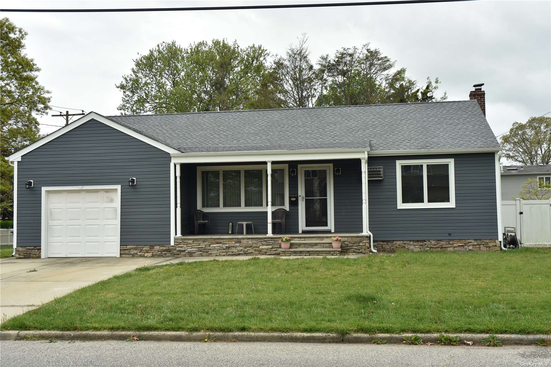 a house that has a tree in front of it