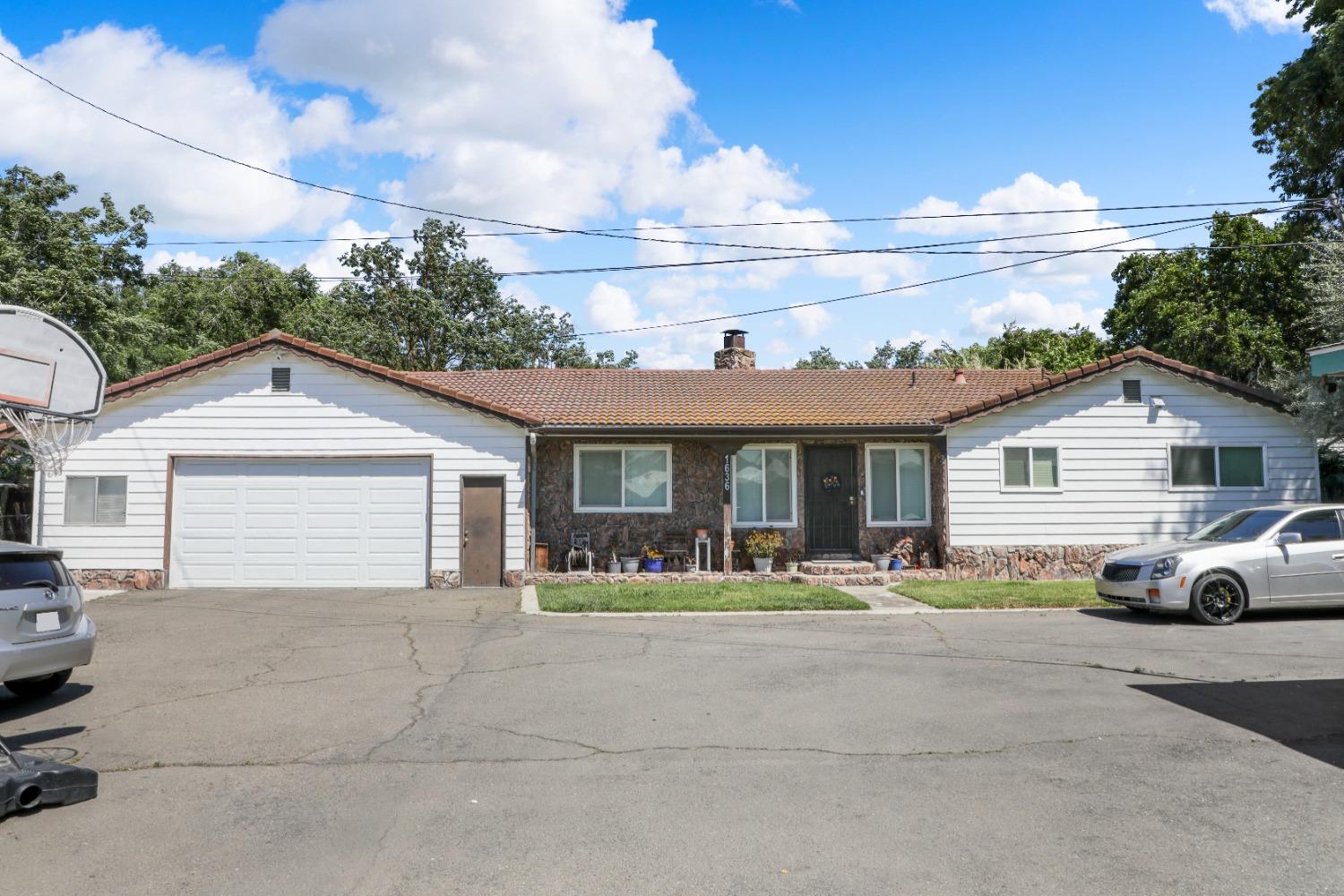 a view of house and outdoor space with garage