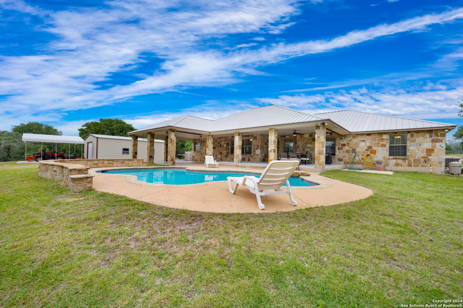 a view of a house with swimming pool