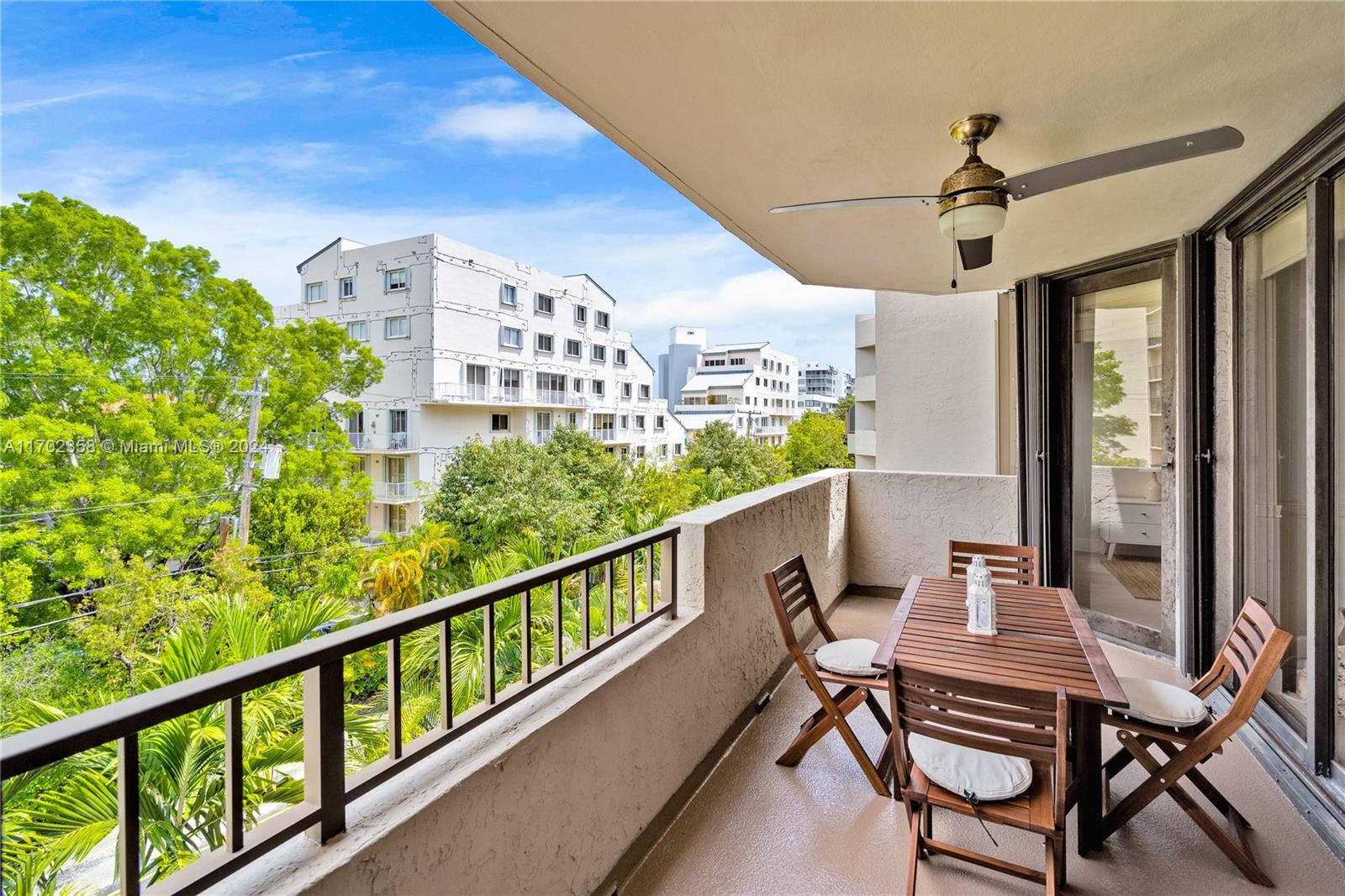 a view of a balcony with furniture