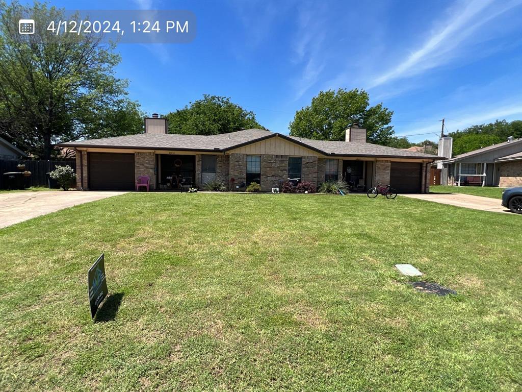 a house with yard in front of it