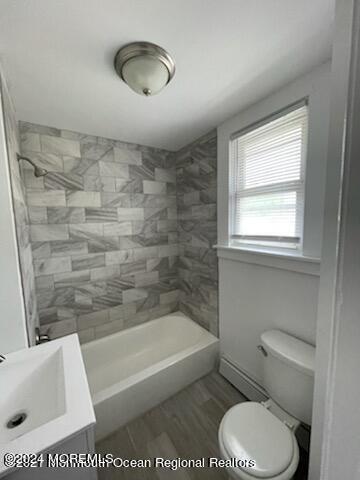 a bathroom with a toilet a sink and a bathtub