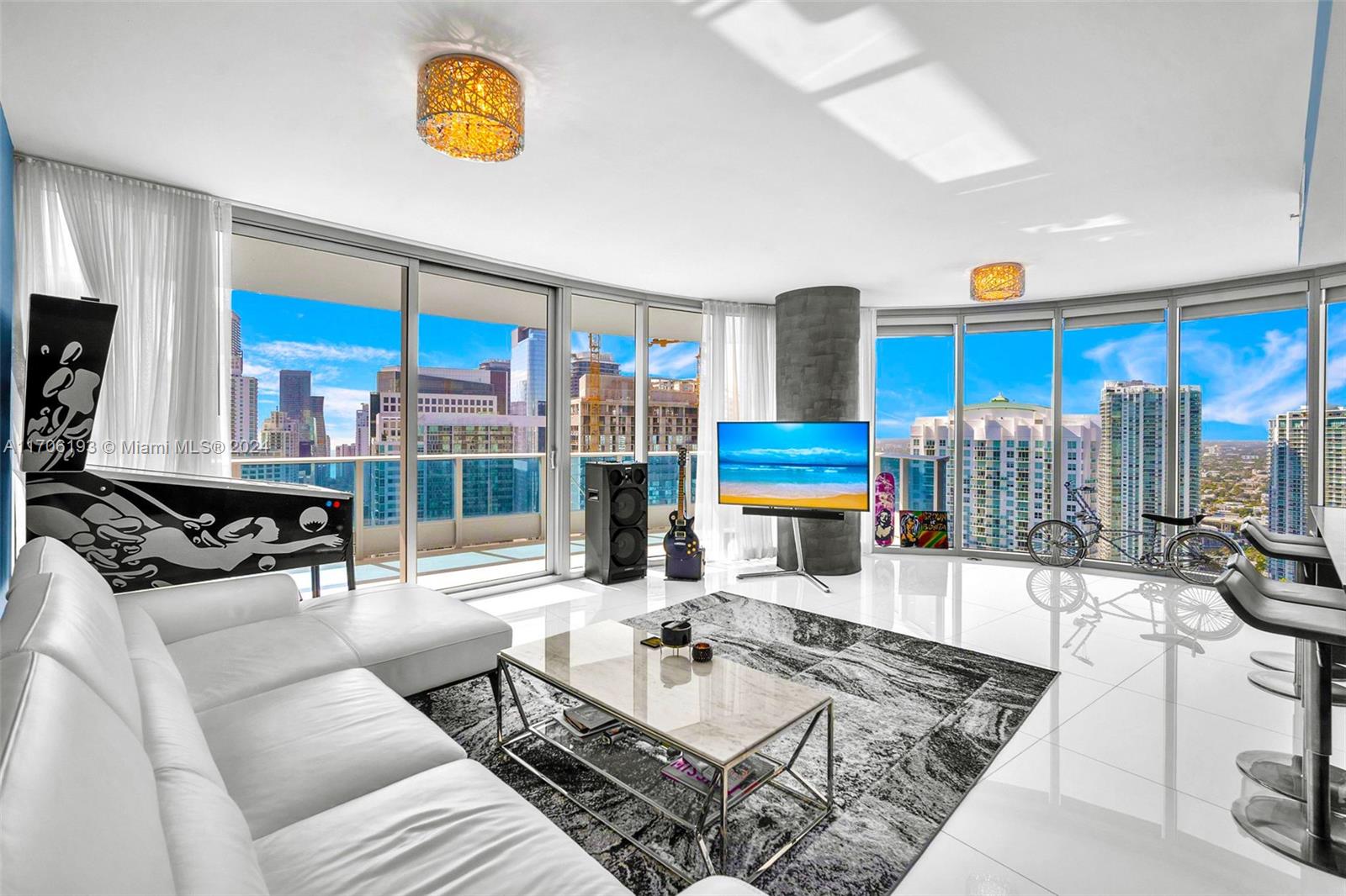 a living room with furniture a rug and a flat screen tv