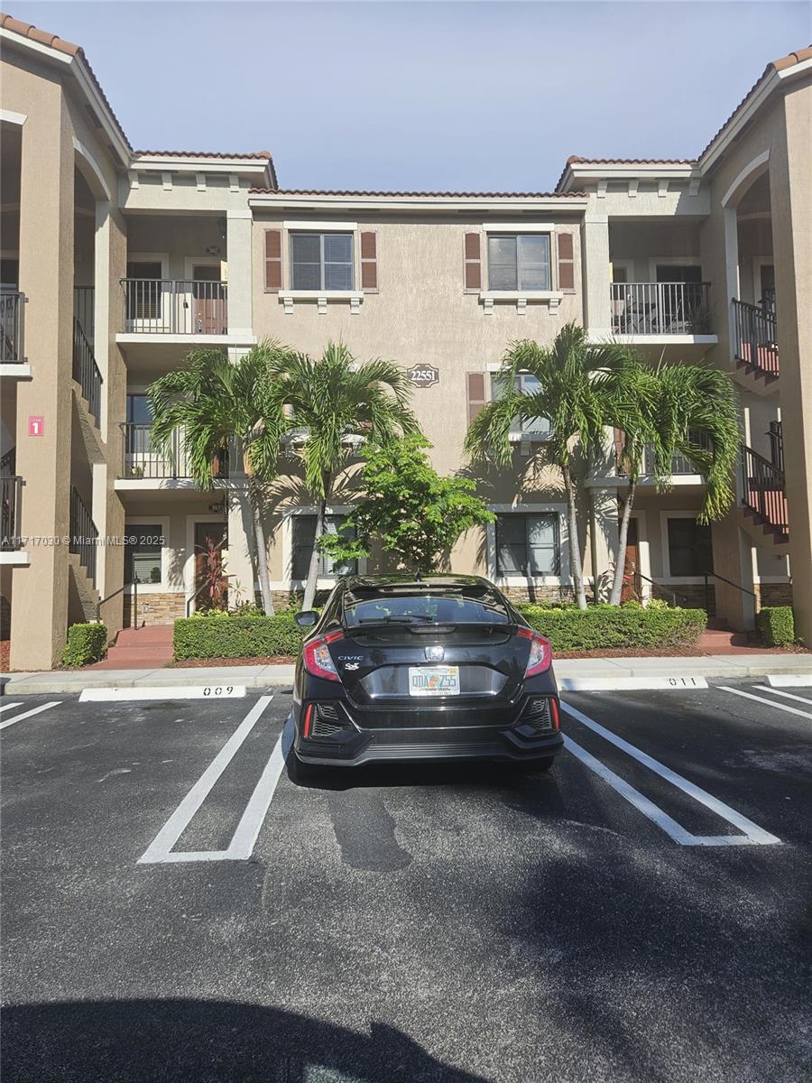 a view of a car in front of a house