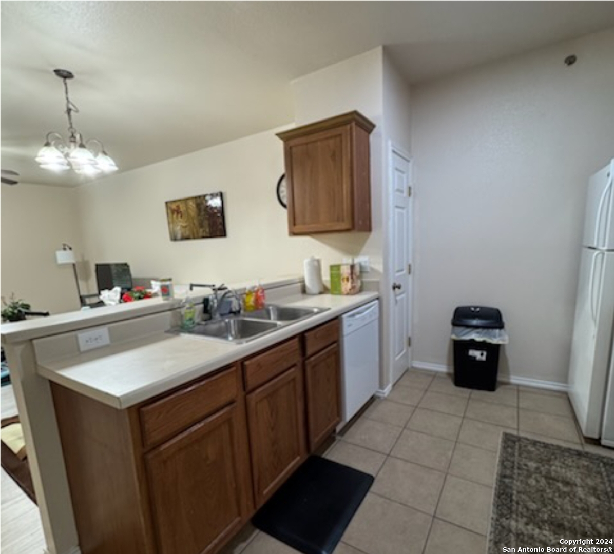 a kitchen with a sink and a stove top oven