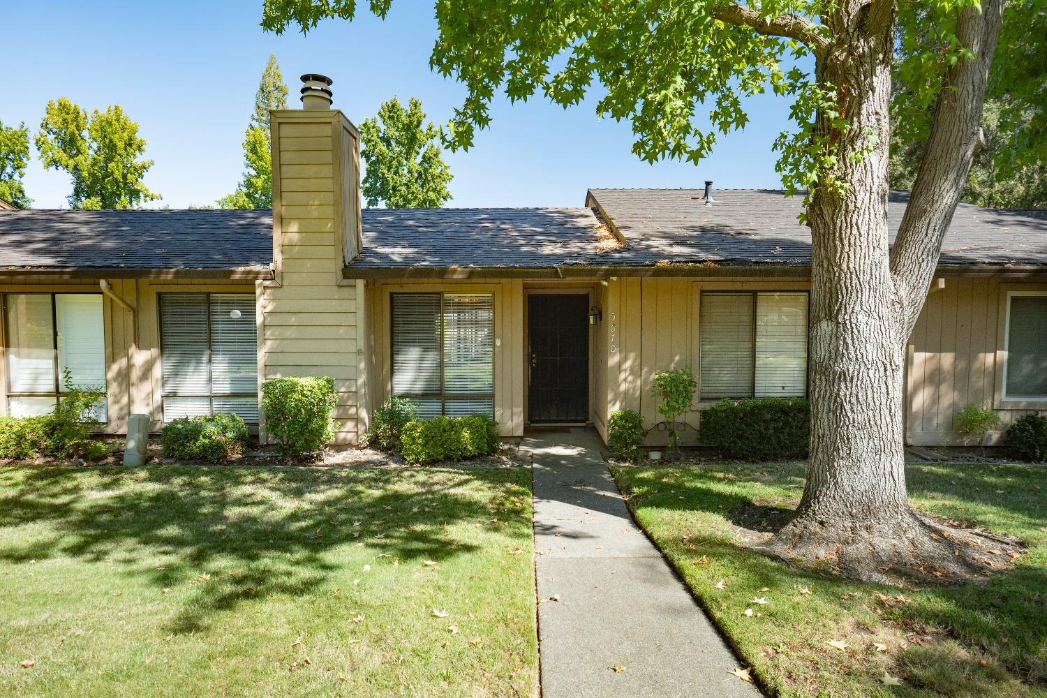 front view of a house with a yard