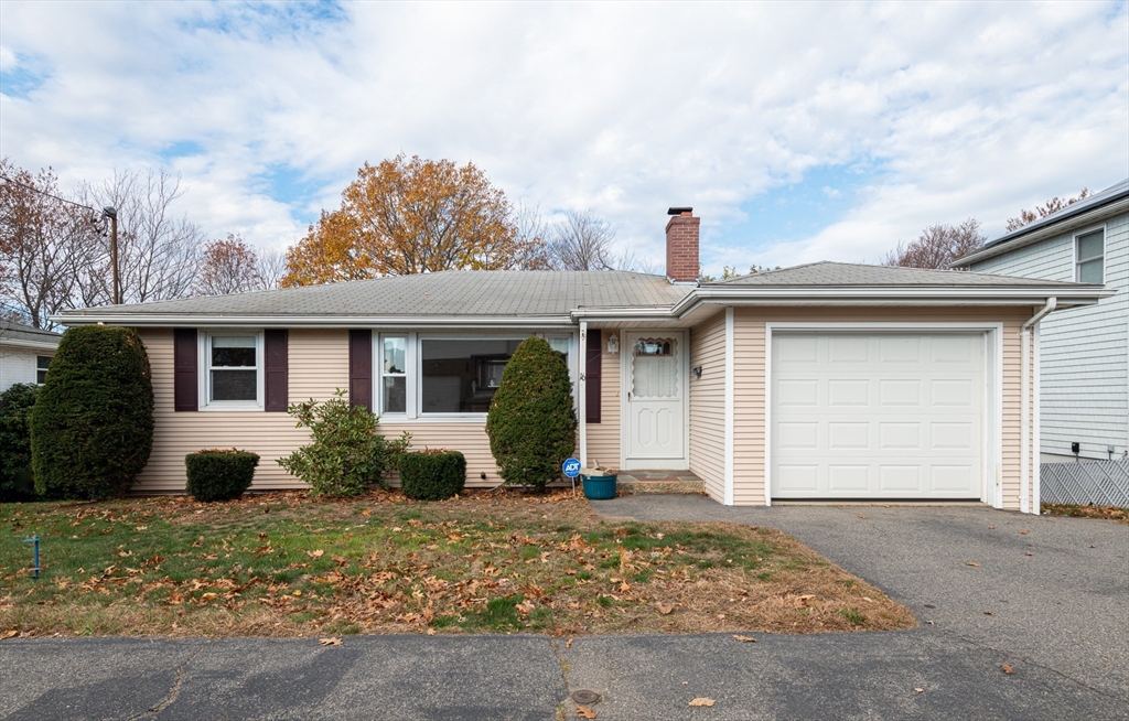 front view of a house with a yard