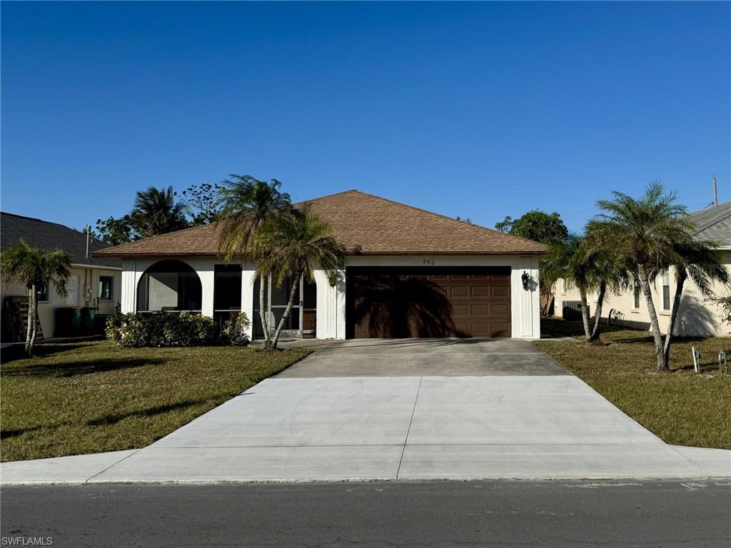 Newly installed driveway, sod and mailbox.