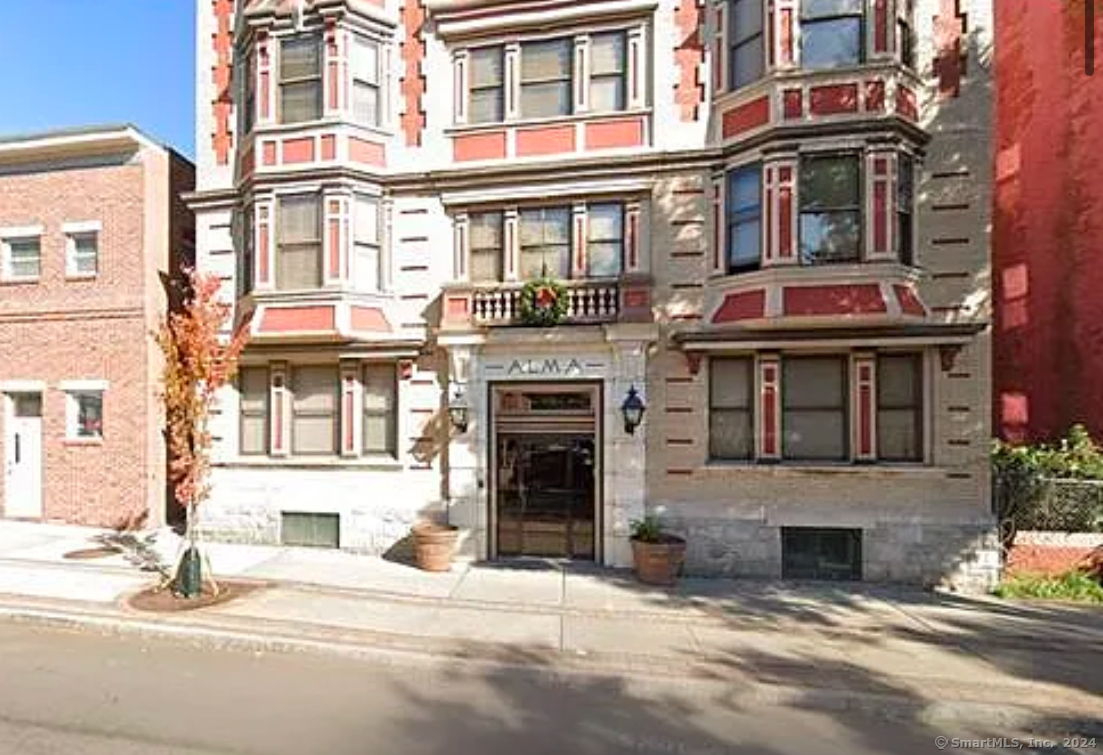 a view of a building with a window and a fireplace