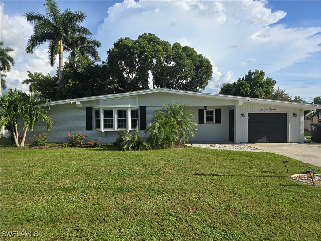 front view of a house with a garden