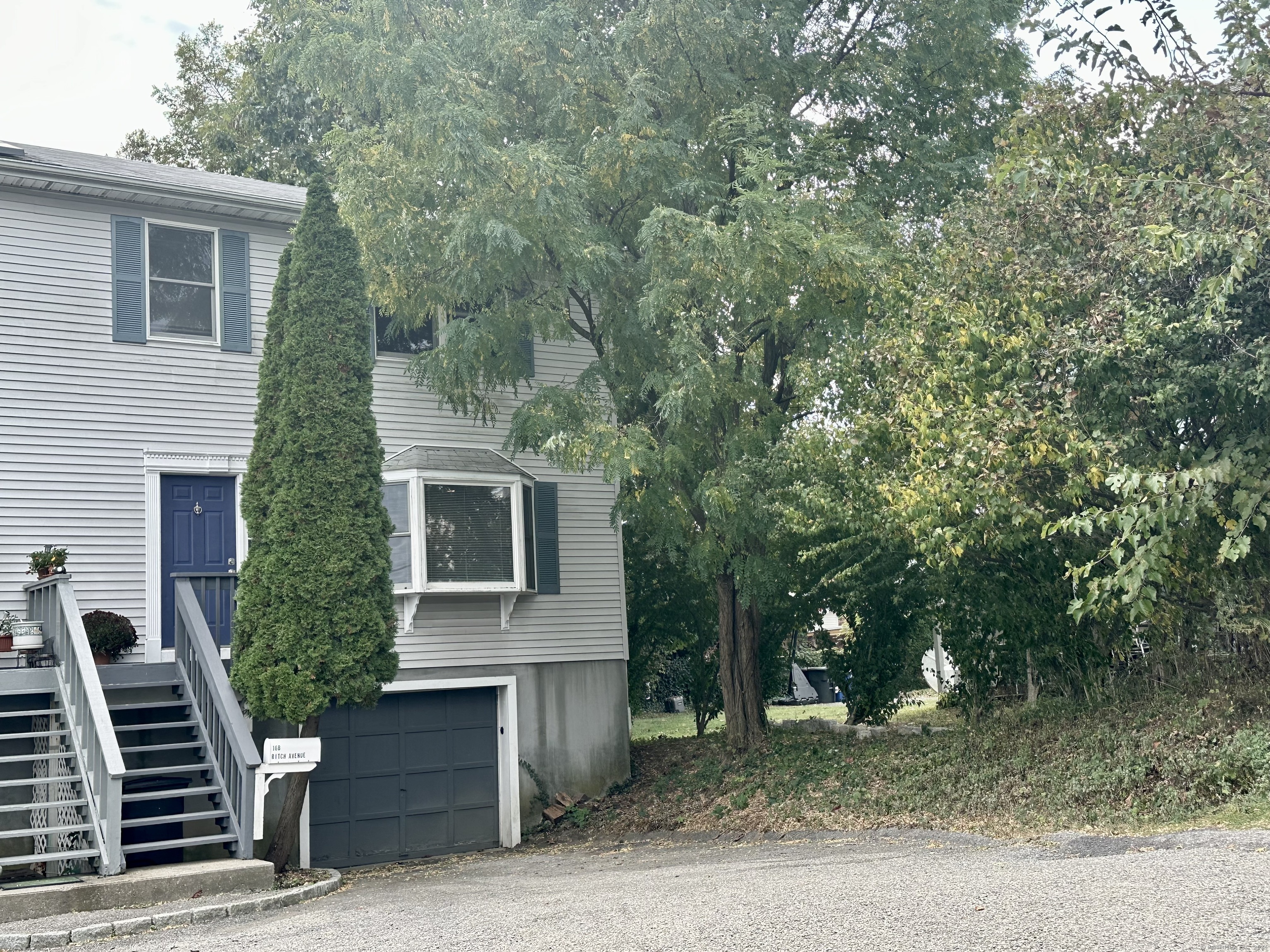 a front view of a house with stairs