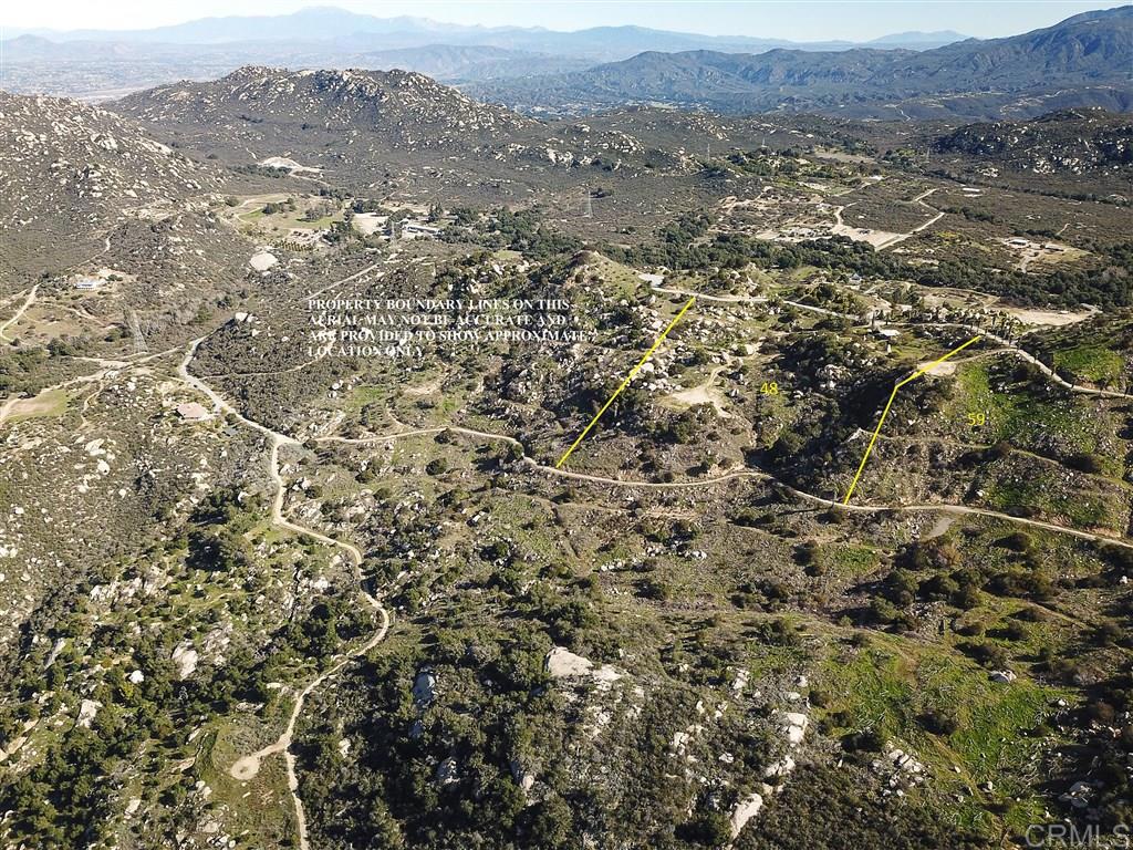 an aerial view of residential house and green space