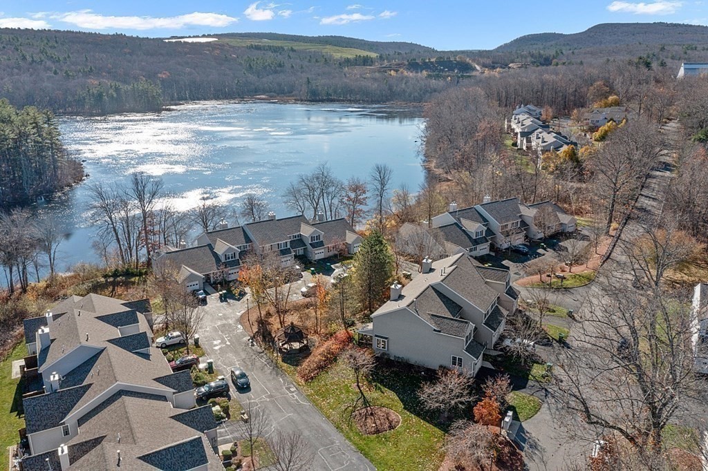 an aerial view of house with yard and mountain view