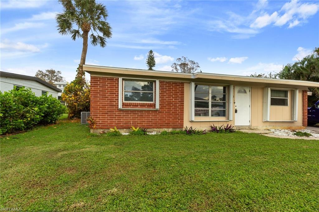 front view of a house with a yard