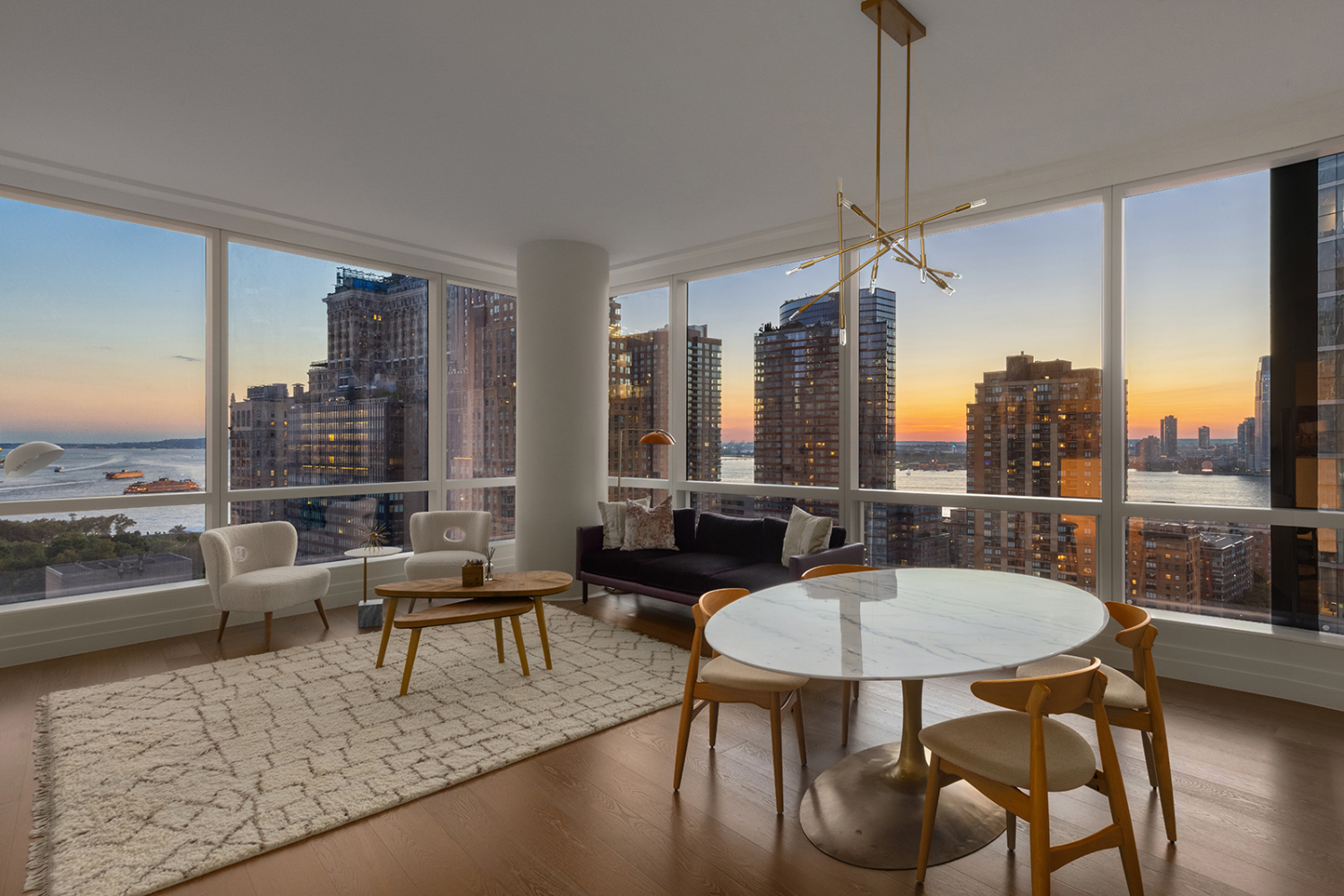 a living room with furniture and a floor to ceiling window