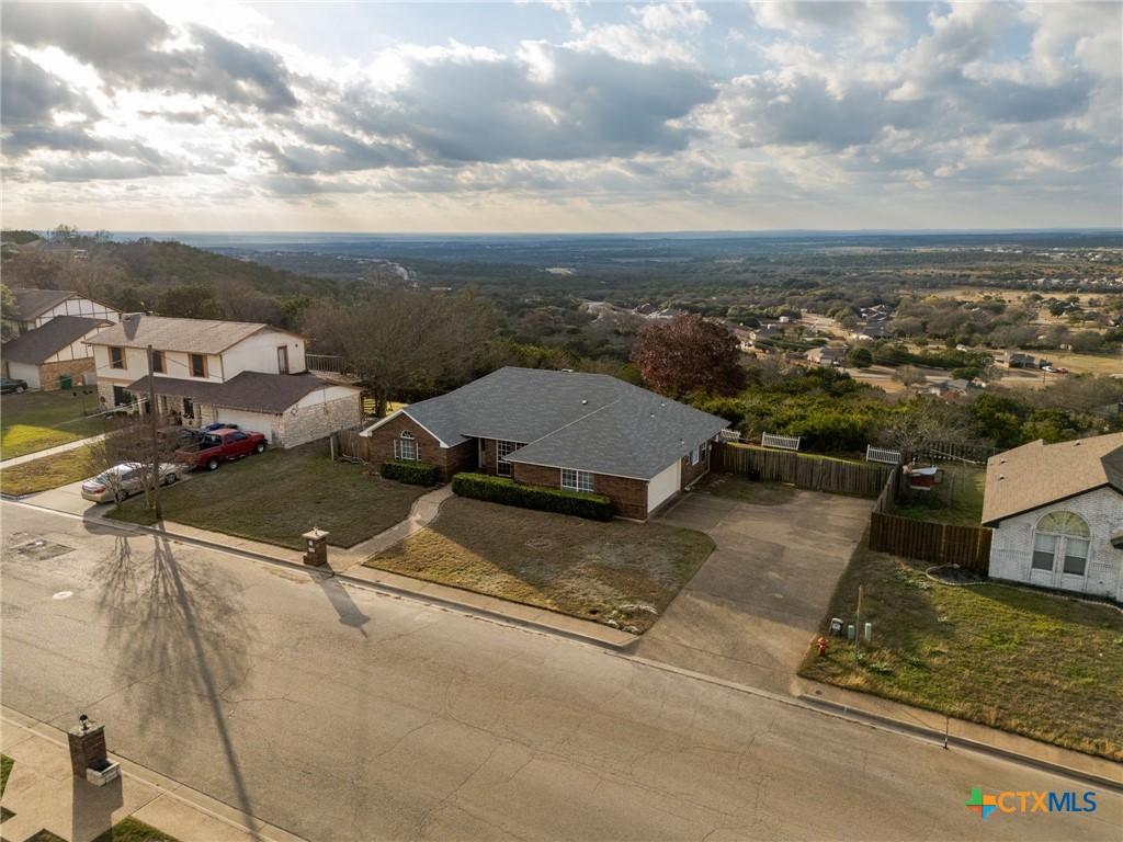 an aerial view of residential houses with outdoor space